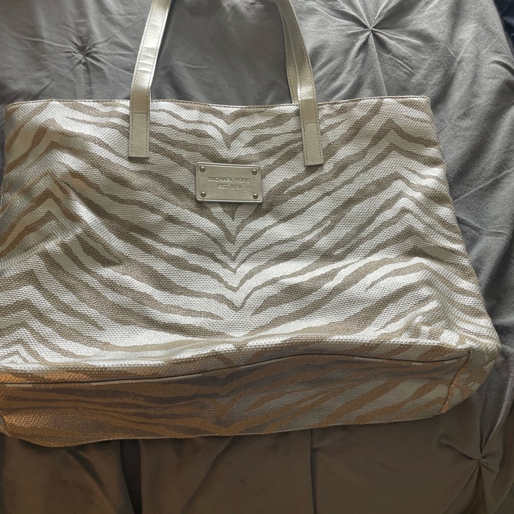 MK metallic silver with zebra striped handbag, or tote.